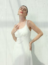 White dress with sleeveless design and hidden pockets