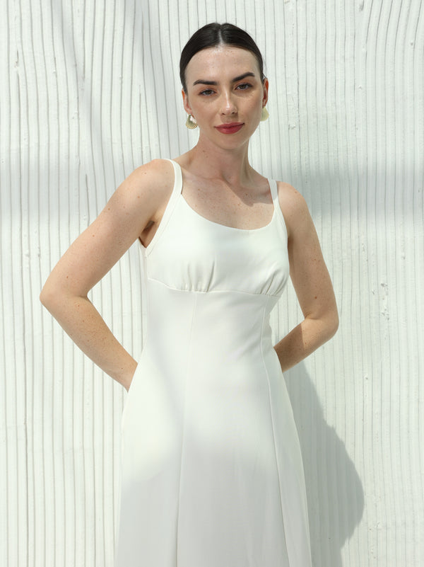 White dress with sleeveless design and hidden pockets
