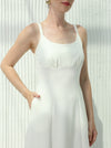 White dress with sleeveless design and hidden pockets
