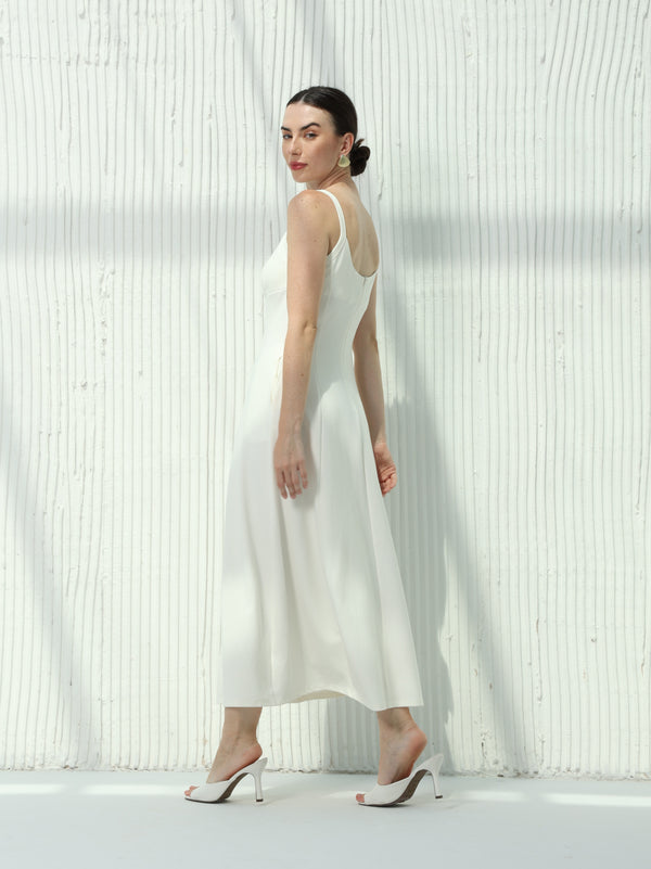 White dress with sleeveless design and hidden pockets
