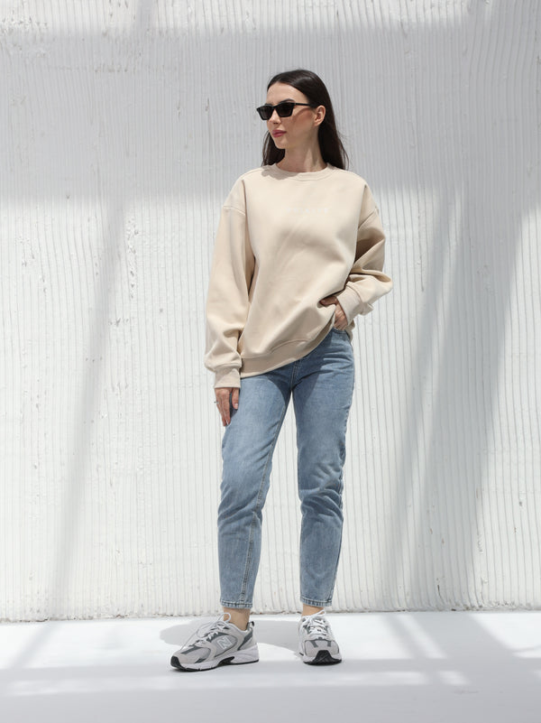 A winter free size T-shirt with embroidered writing in Beige