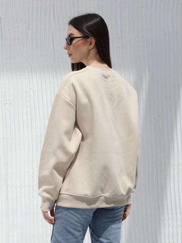 A winter free size T-shirt with embroidered writing in Beige