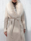 Long beige coat with fur collar and belt