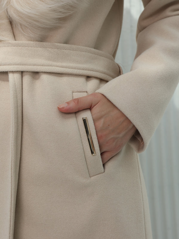 Long beige coat with fur collar and belt