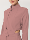 Two-piece set in one color with a short jacket and long sleeves
