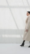 Long beige coat with fur collar and belt