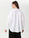 Loose blouse with pleats in the middle