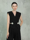 Elegant black two-piece set with a silver brooch