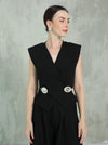 Elegant black two-piece set with a silver brooch