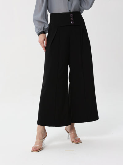Formal trousers with a wide waist and buttons on the front