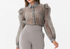 Organza blouse with ruffles at the shoulder