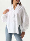 Loose shirt with wide buttons in the front and a V opening