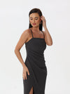 Midi dress with ruffles at the waist, a thigh slit, and half straps with metal decoration