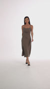 Midi dress with ruffles at the waist, a thigh slit, and half straps with metal decoration